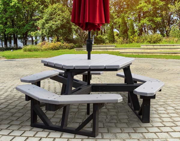 hexagon shaped picnic table with red umbrella