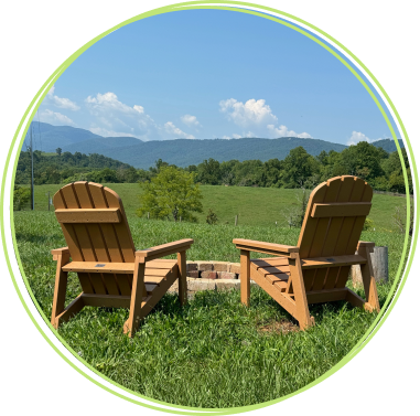 2 adirondack chairs with mountains in the background